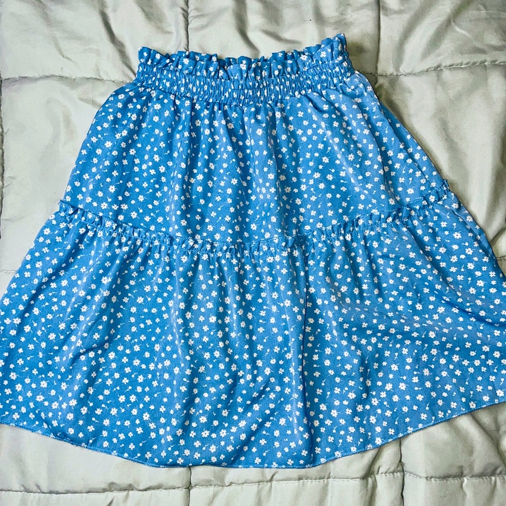Blue skirt with white little flowers